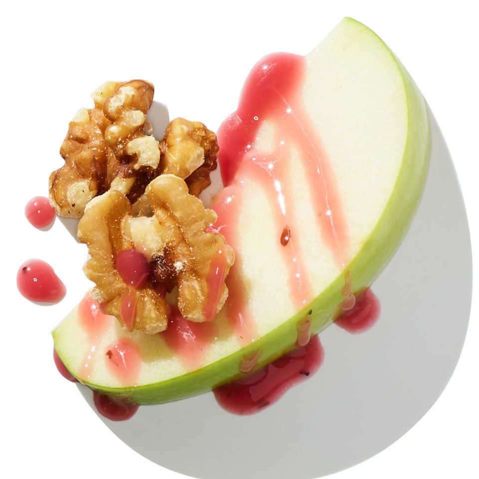 Apple slice with berry vinaigrette and walnuts