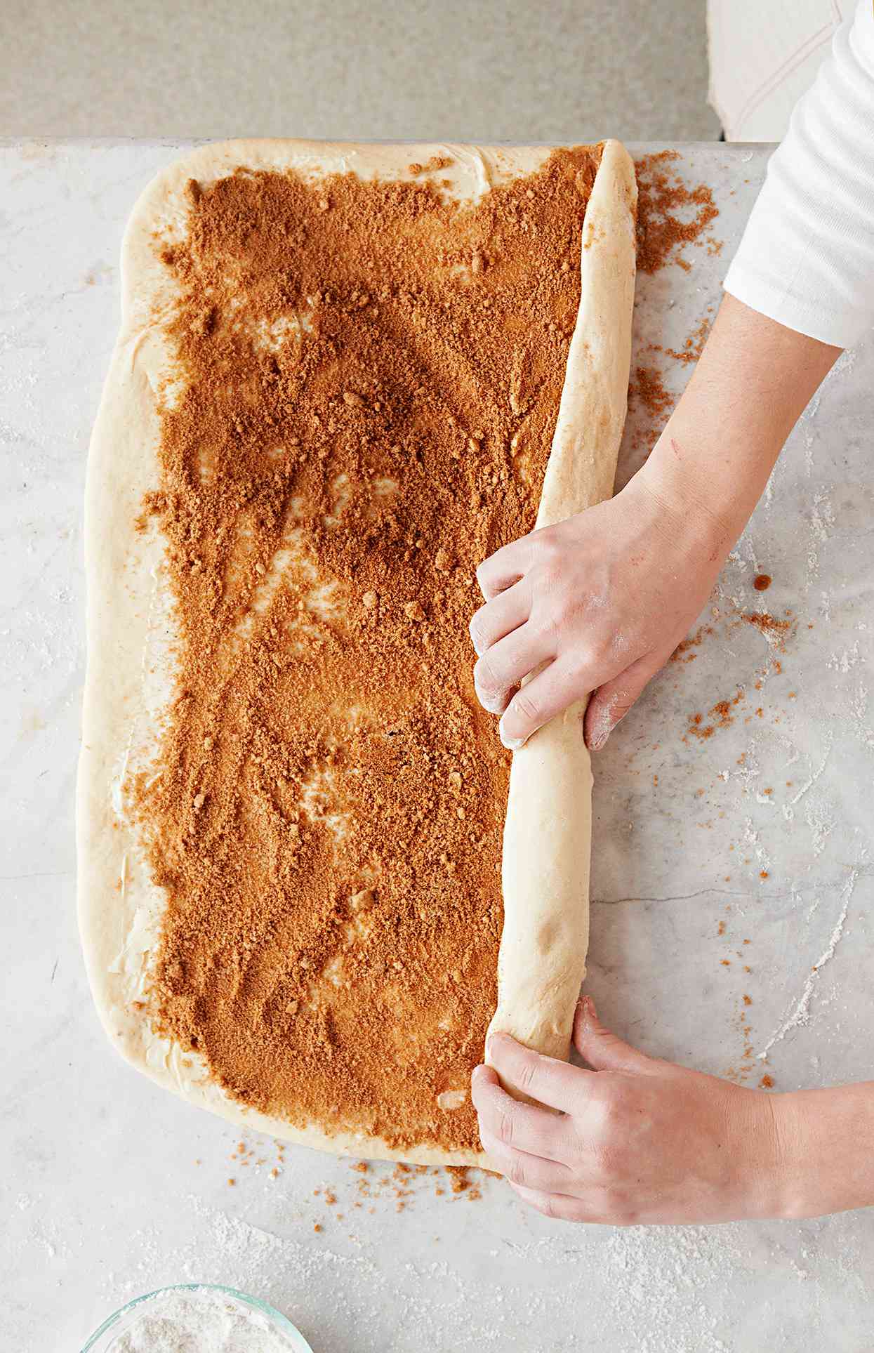 Rolling cinnamon roll dough