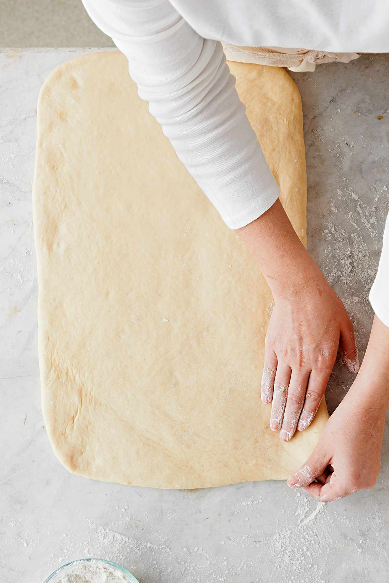 Shape cinnamon roll dough