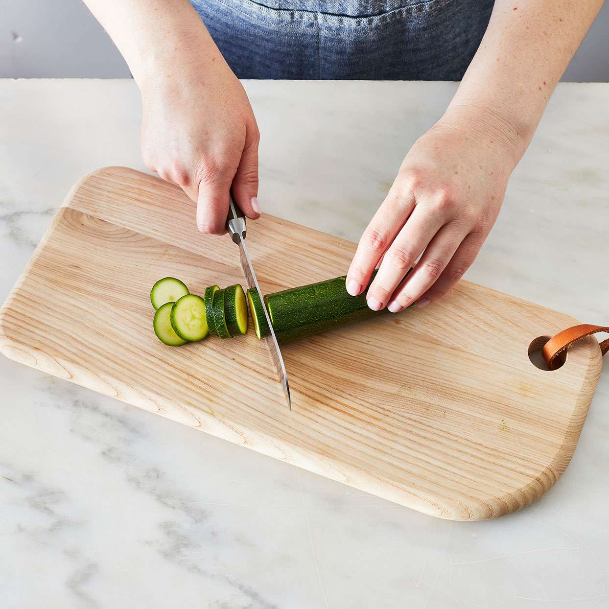 Slicing-zucchini-to-saute