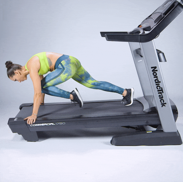 Robin Arzón performing mountain climbers on a treadmill