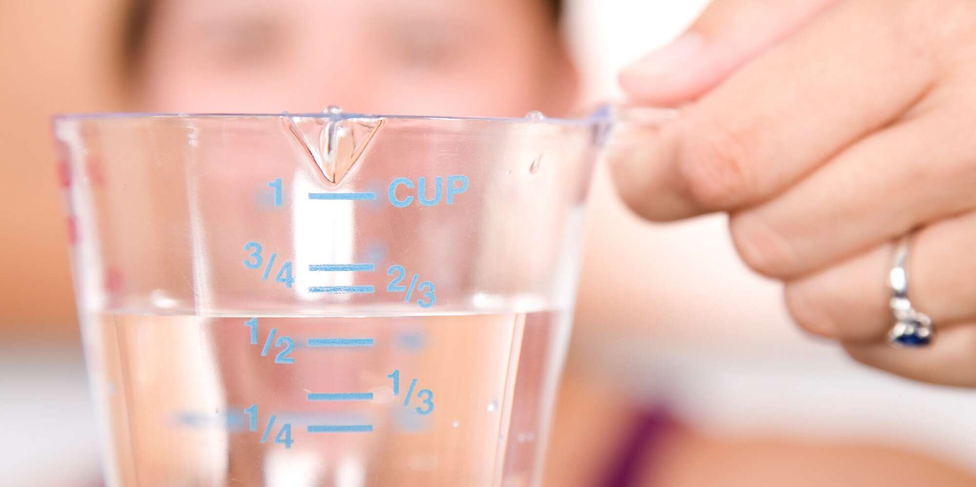 Oil In Measuring Cup On Table In Kitchen Stock Photo, Picture and