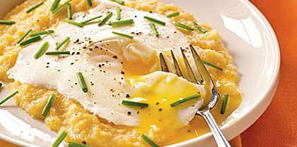 Eggs Blindfolded over Garlic-Cheddar Grits Recipe | MyRecipes