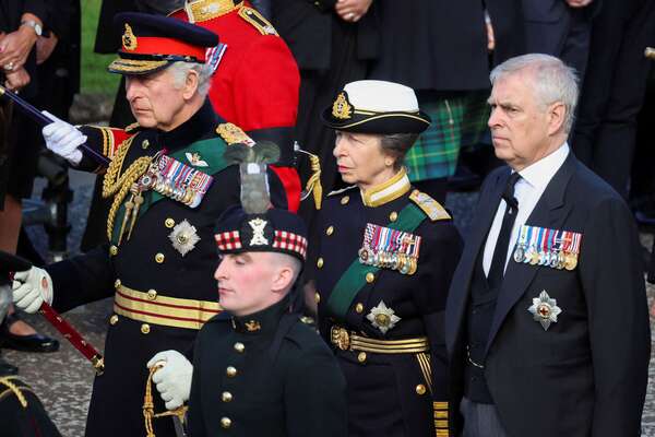 Britain's King Charles III (L), Britain's Princess Anne, Princess Royal (C), and Britain's Prince Andrew, Duke of York walk behind the procession of Queen Elizabeth II's coffin, from the Palace of Holyroodhouse to St Giles Cathedral, on the Royal Mile on September 12, 2022, where Queen Elizabeth II will lie at rest. - Mourners will on Monday get the first opportunity to pay respects before the coffin of Queen Elizabeth II, as it lies in an Edinburgh cathedral where King Charles III will preside over a vigil.