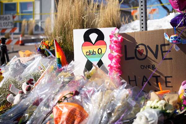 Mandatory Credit: Photo by David Zalubowski/AP/Shutterstock (13632768d) Bouquets of flowers sit on a corner near the site of a mass shooting at a gay bar, in Colorado Springs, Colo. Club Q on its Facebook page thanked the "quick reactions of heroic customers that subdued the gunman and ended this hate attack Shooting, Colorado Springs, United States - 21 Nov 2022