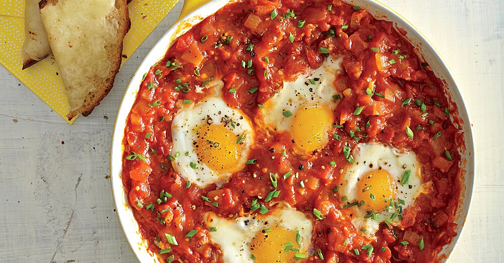 Eggs Poached in Tomato Sauce & Garlic Cheese Toasts Recipe | MyRecipes