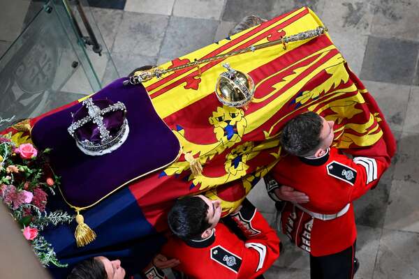 The coffin of Queen Elizabeth II with the Imperial State Crown resting on top is carried by the Bearer Party into Westminster Abbey during the State Funeral of Queen Elizabeth II on September 19, 2022 in London, England. Elizabeth Alexandra Mary Windsor was born in Bruton Street, Mayfair, London on 21 April 1926. She married Prince Philip in 1947 and ascended the throne of the United Kingdom and Commonwealth on 6 February 1952 after the death of her Father, King George VI. Queen Elizabeth II died at Balmoral Castle in Scotland on September 8, 2022, and is succeeded by her eldest son, King Charles III.