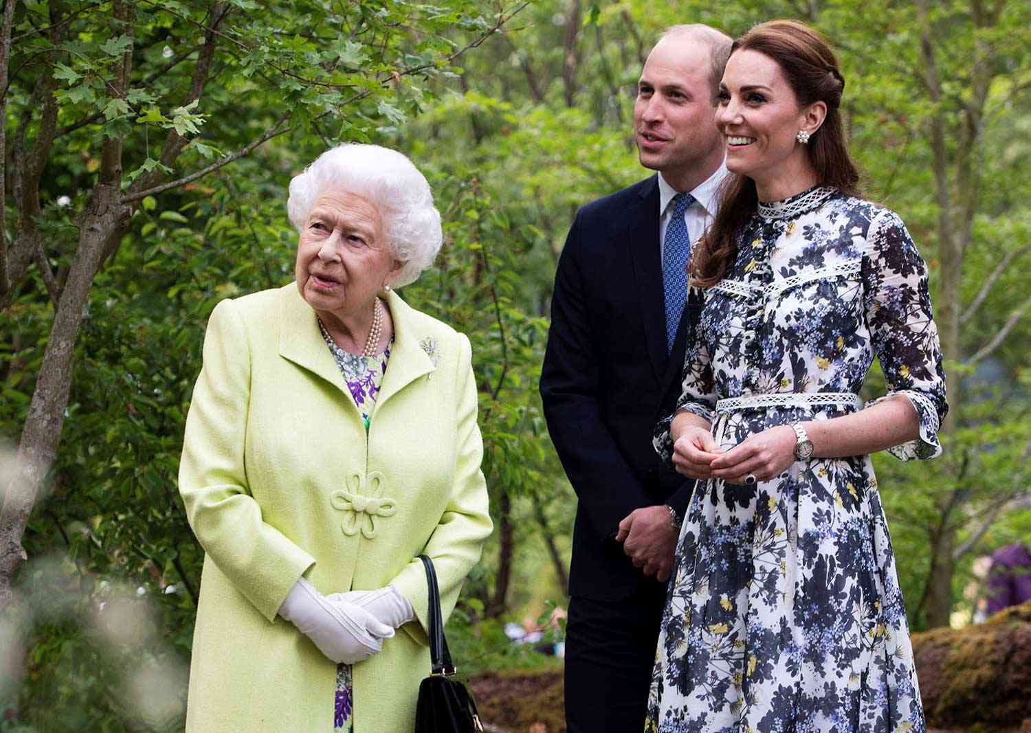 Britain's Catherine, Duchess of Cambridge (R) shows Britain's Queen Elizabeth II (L) and Britain's Prince William, Duke of Cambridge, around the 'Back to Nature Garden' garden, that she designed along with Andree Davies and Adam White, during their visit to the 2019 RHS Chelsea Flower Show in London on May 20, 2019.