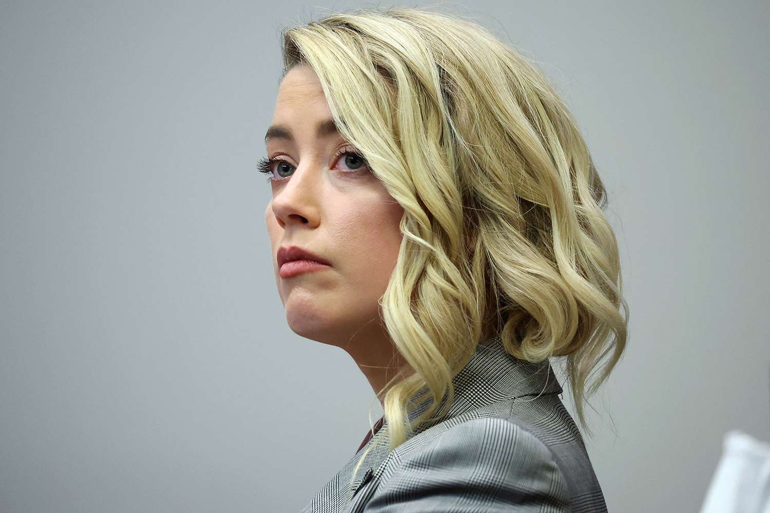 US actor Amber Heard during the 50 million US dollar Depp vs Heard defamation trial at the Fairfax County Circuit Court in Fairfax, Virginia, on May 26, 2022. - Actor Johnny Depp is suing ex-wife Amber Heard for libel after she wrote an op-ed piece in The Washington Post in 2018 referring to herself as a public figure representing domestic abuse.
