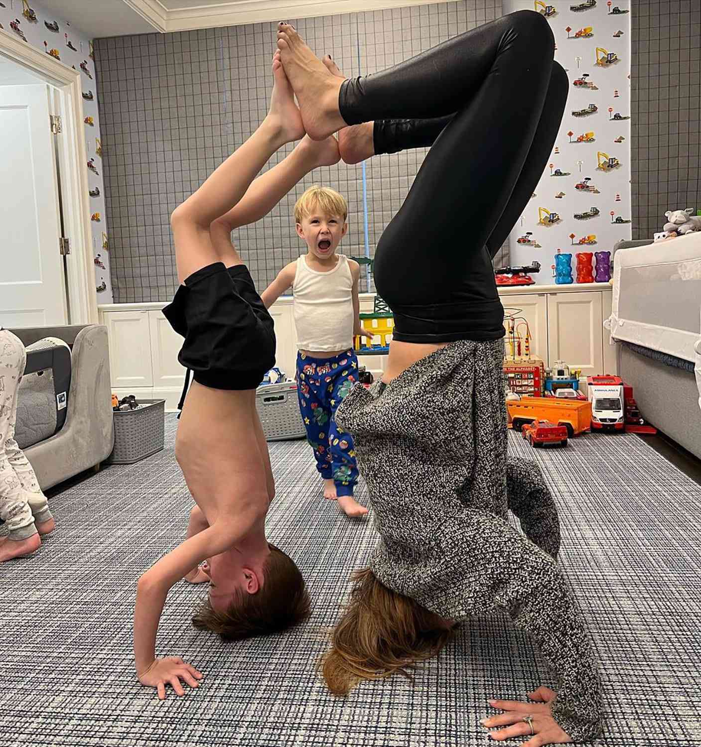 Hilaria Baldwin Poses Upside Down with Sons Rafael and Romeo for Yoga