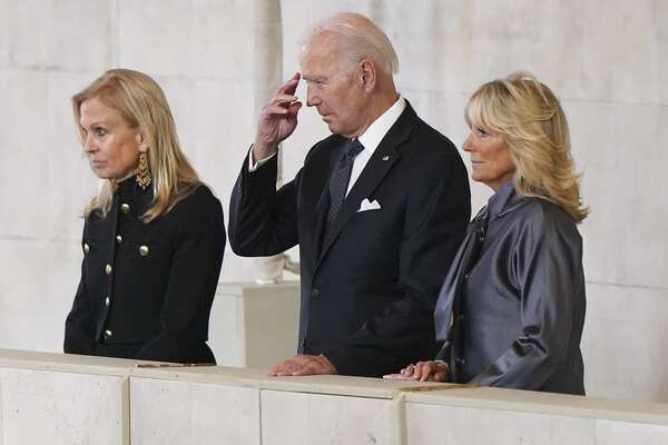 US President Joe Biden and First Lady Jill Biden pay their respects as they view the coffin of Queen Elizabeth II, as it Lies in State inside Westminster Hall, at the Palace of Westminster in London on September 18, 202