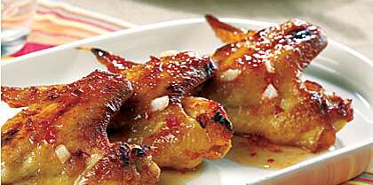 image of Chicken Wings with Spicy Chili Sauce Recipe | MyRecipes