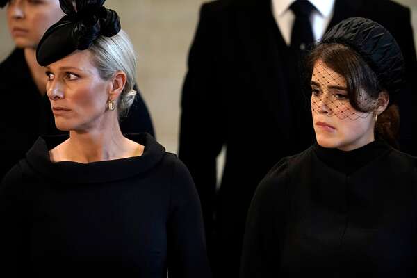 Zara Tindall and Princess Eugenie pay their respects in The Palace of Westminster after the procession for the Lying-in State of Queen Elizabeth II
