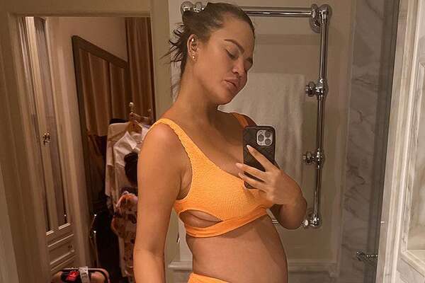 Chrissy Teigen Shares Bump Pictures in a Photo Dump from Family Vacation