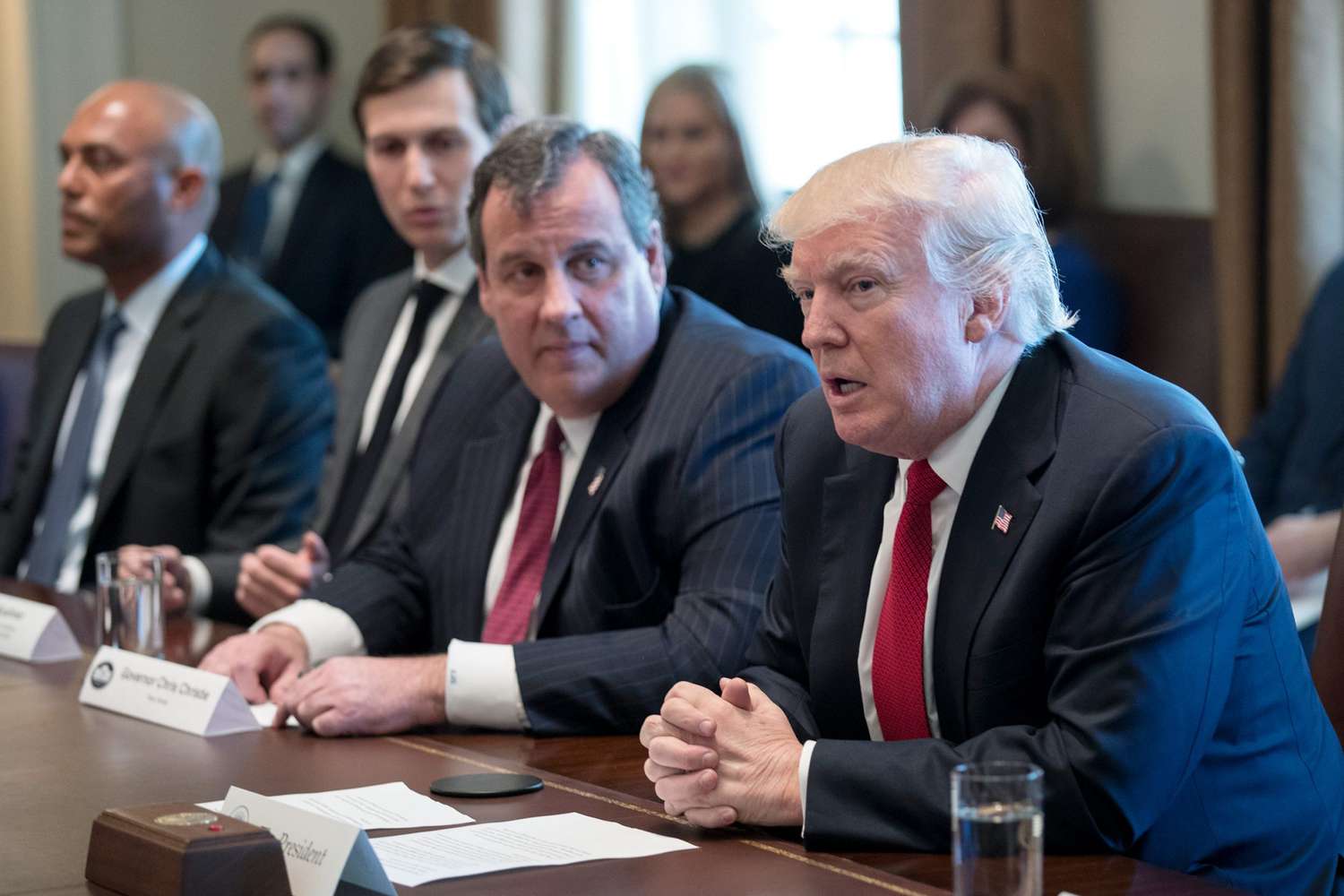 U.S. President Donald Trump (L) and New Jersey Gov. Chris Christie attend a panel discussion on an opioid and drug abuse in the Roosevelt Room of the White House March 29, 2017 in Washington