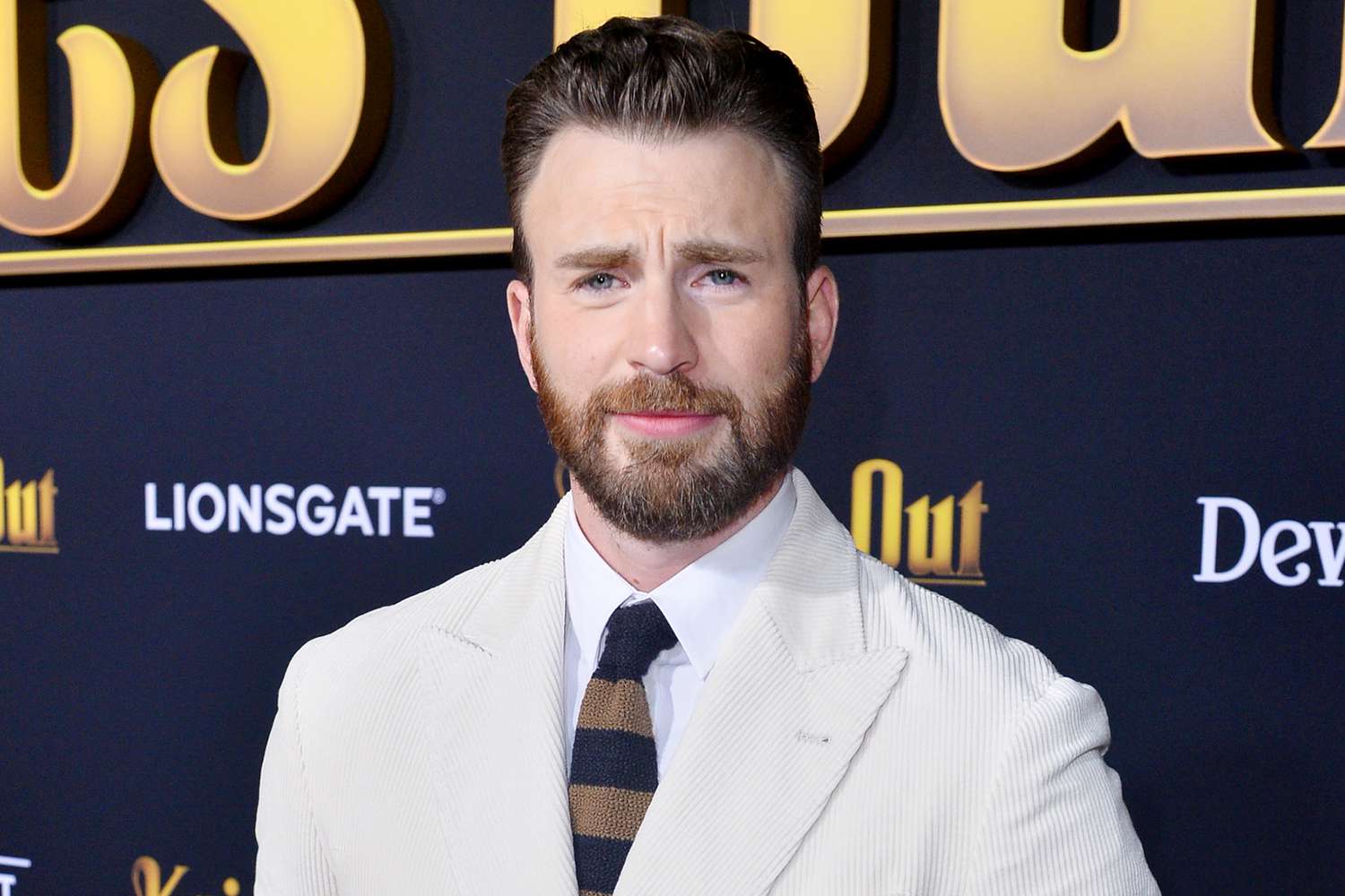 Chris Evans calls his NSFW photo post 'embarrassing' but says 'you gotta roll with the punches'