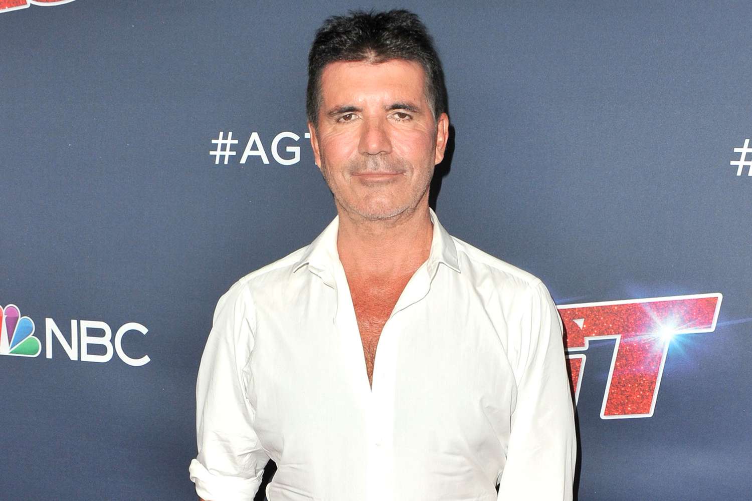 Simon Cowell hospitalized after breaking back in biking accident