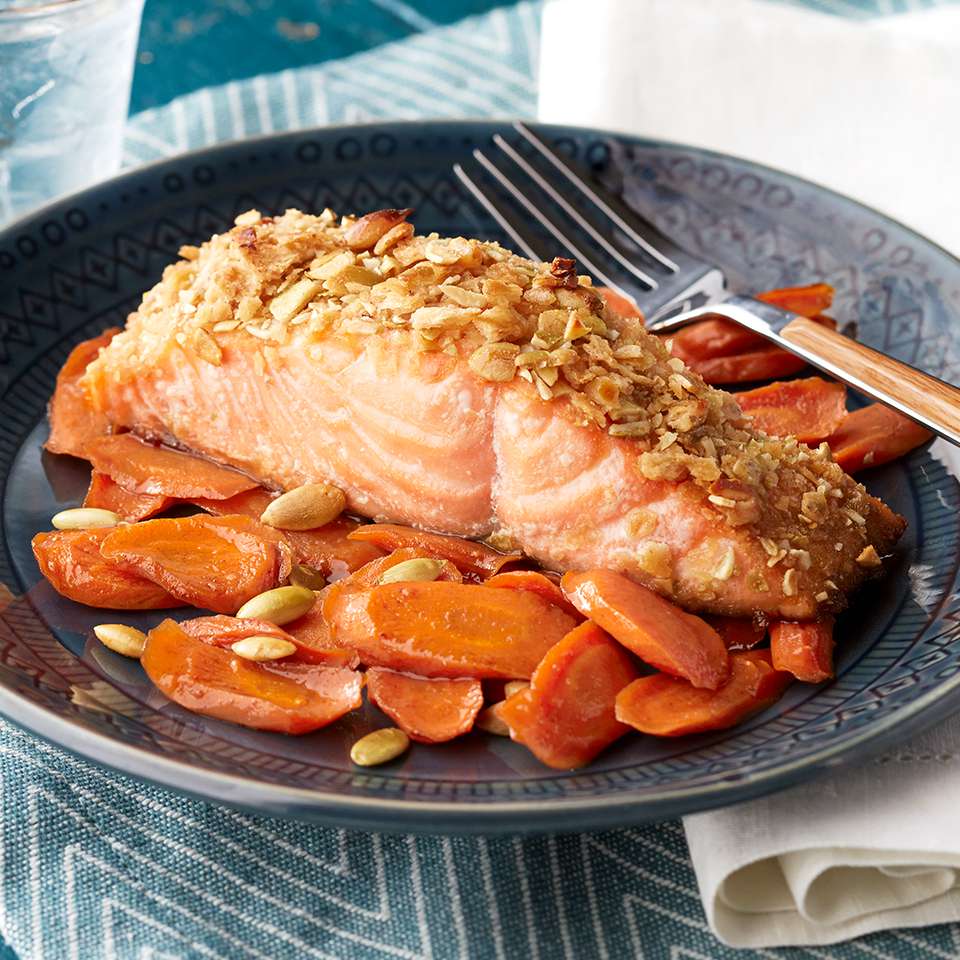 Pumpkin Seed Salmon with Maple-Spice Carrots Recipe | EatingWell