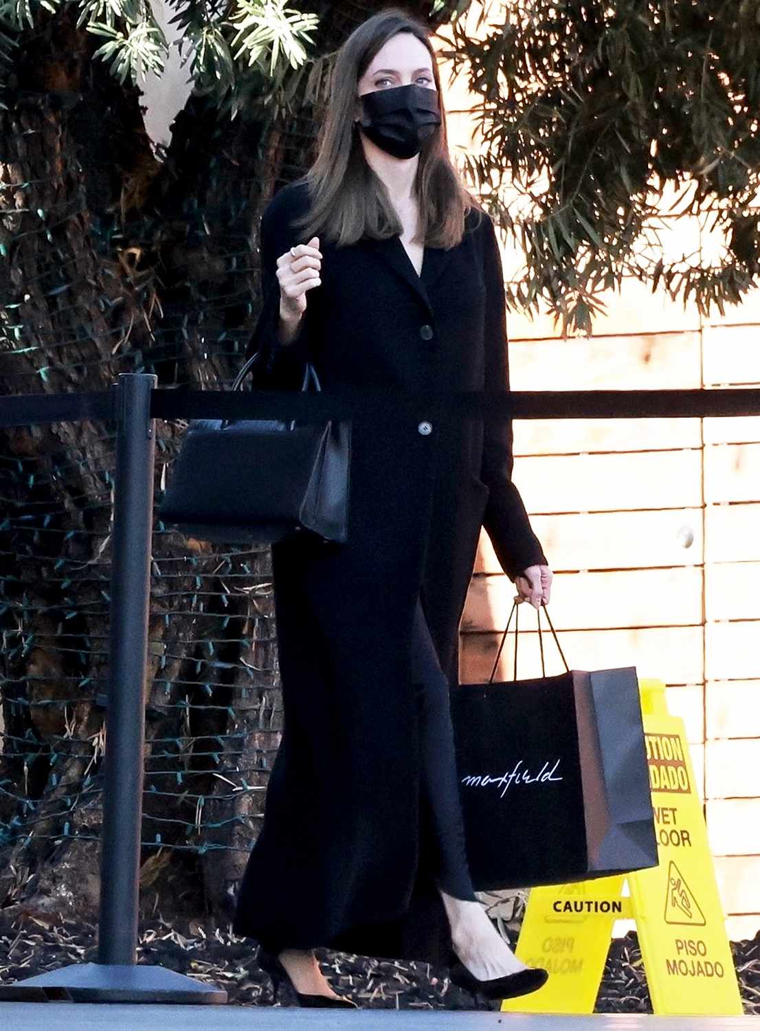 Actress Angelina Jolie joins the crowds of last-minute shoppers in West Hollywood as she purchases gifts on Christmas Eve. Pictured: Angelina Jolie BACKGRID USA 24 DECEMBER 2021