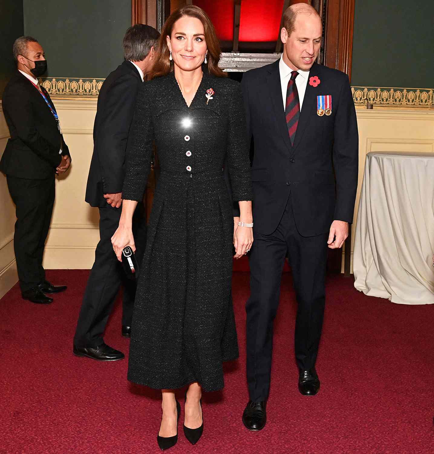Britain's Prince William, Duke of Cambridge (2nd R) and Britain's Catherine, Duchess of Cambridge (C) arrive to attend the annual Royal British Legion Festival of Remembrance at the Royal Albert Hall in London on November 13, 2021.
