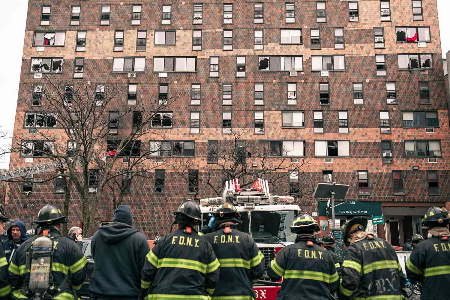 Emergency first responders remain at the scene after an intense fire at a 19-story residential building that erupted in the morning on January 9, 2022 in the Bronx borough of New York City. Reports indicate over 50 people were injured.