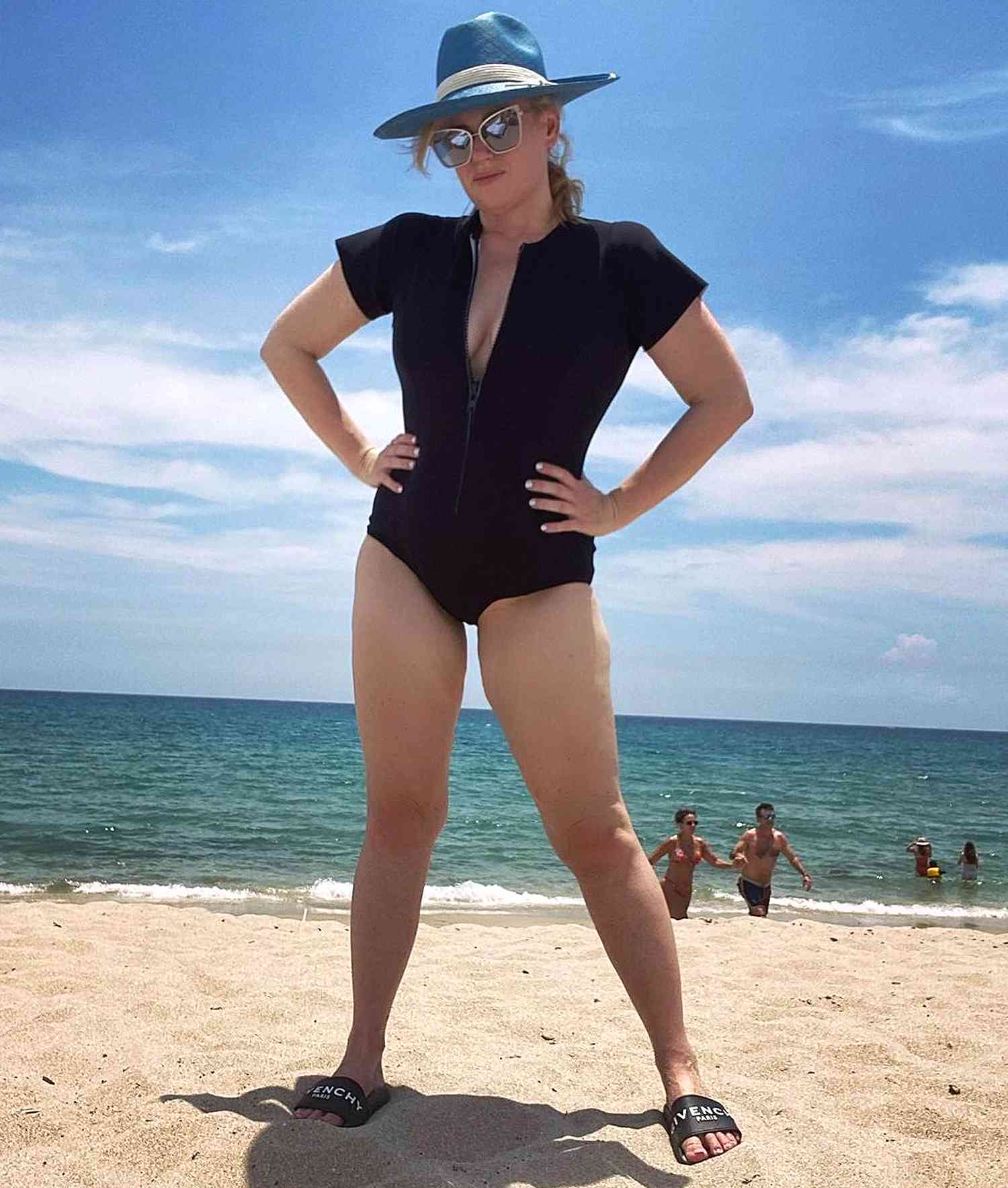 Rebel Wilson Hits the Beach in a Curve-Hugging Swimsuit and Givenchy Slides - PEOPLE
