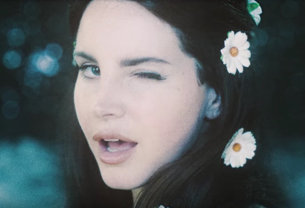 Here S How To Copy Lana Del Rey S 60s Inspired Daisy Adorned Hairstyle In Her New Video Hellogiggles