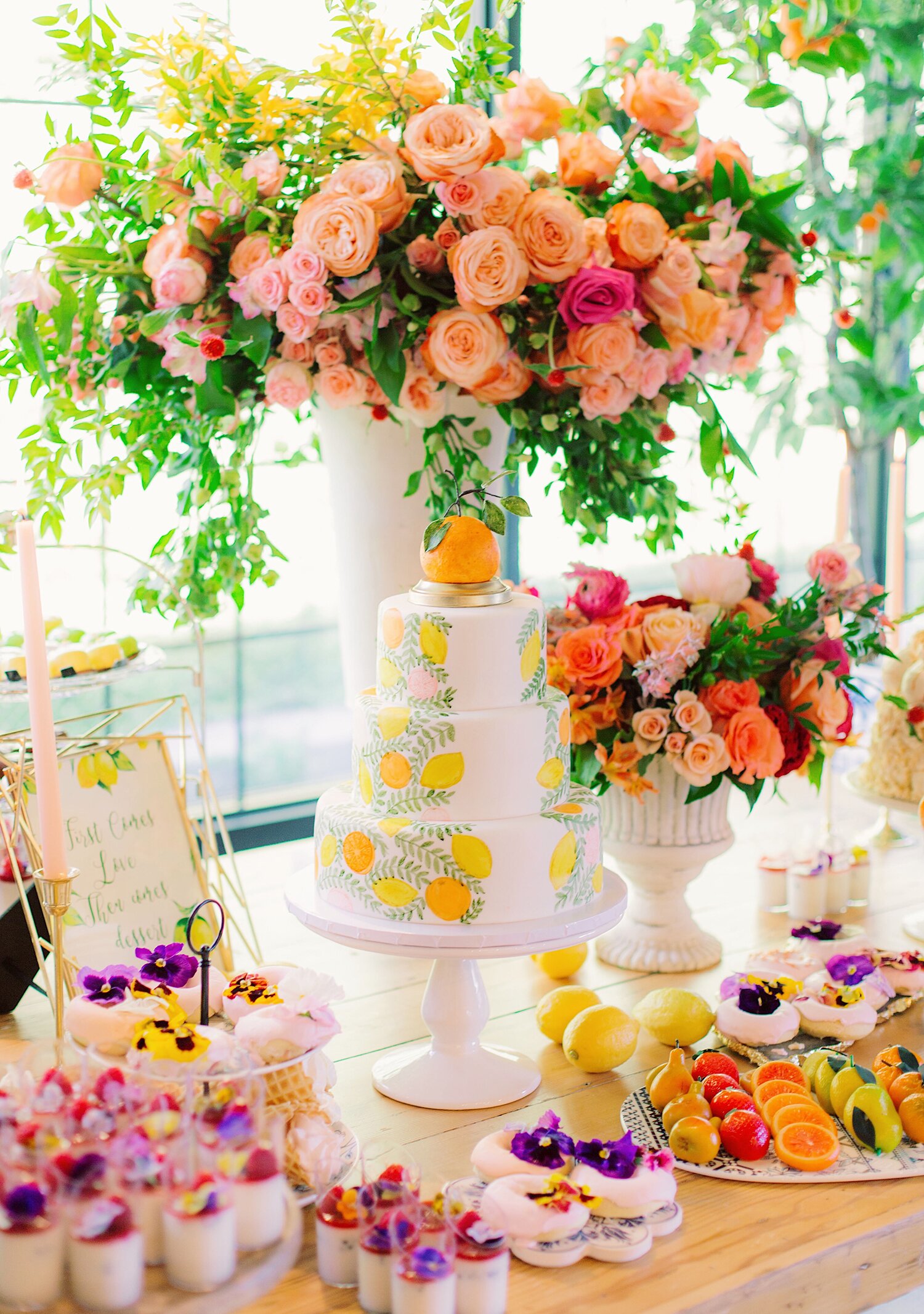 neon cake and flowers on table