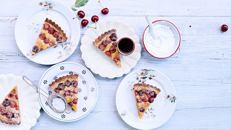 sour-cherry frangipane tart topped with powdered sugar