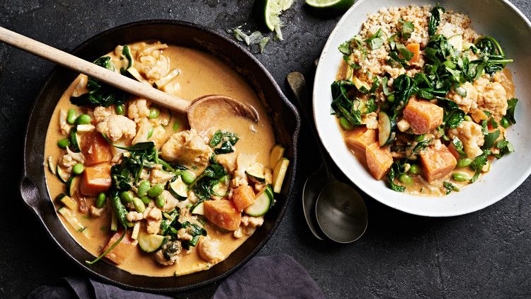 cauliflower-sweet potato curry served with cilantro and lime