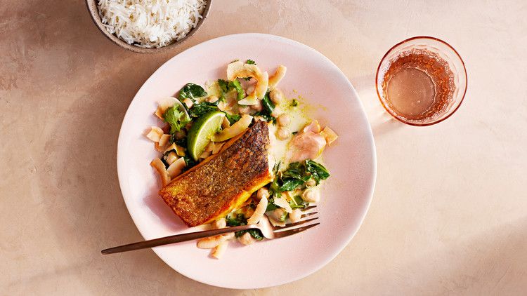 crispy salmon with coconut-ginger collards served with fresh cilantro