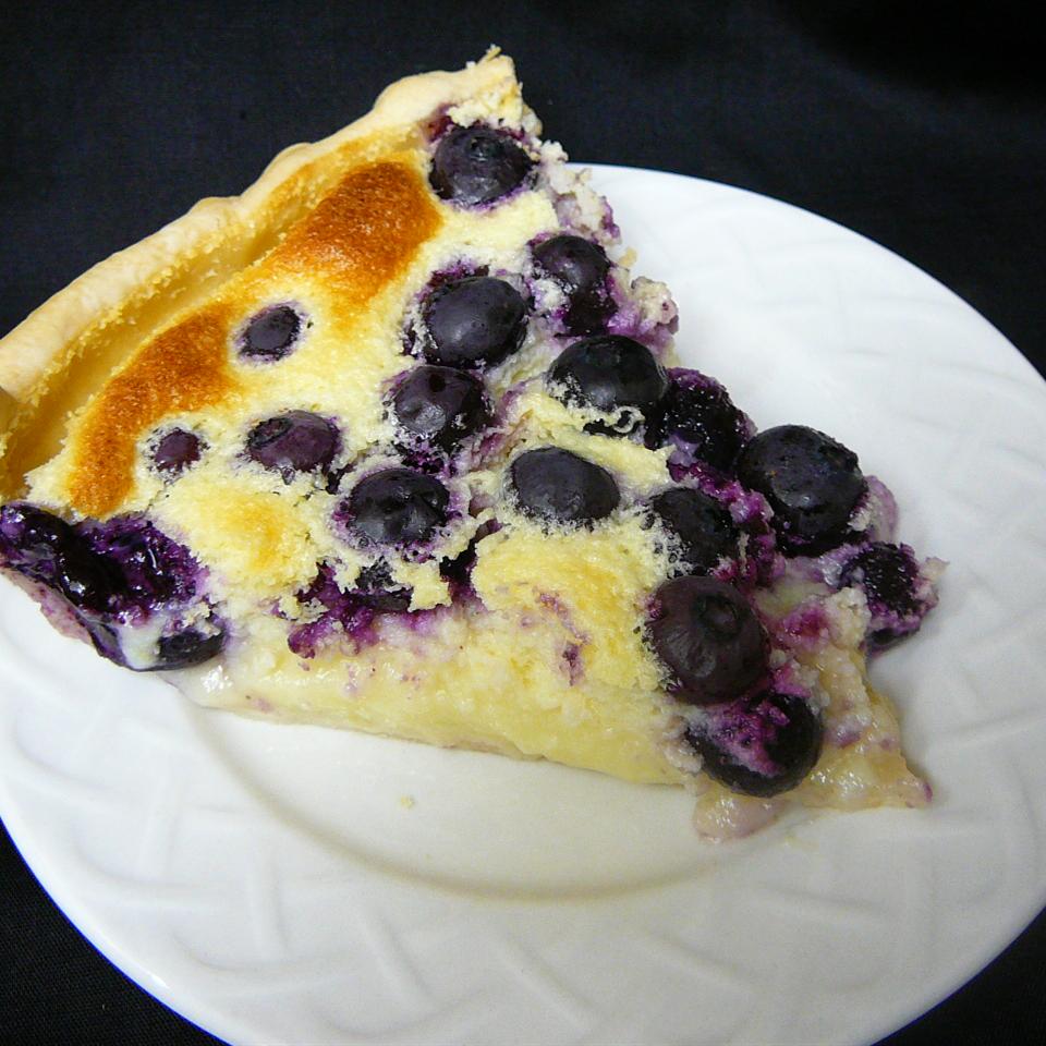 <p>This delicious custard pie has a light meringue-like consistency and a lovely burst of lemon flavor. You can make it with or without the blueberries, or change them out for raspberries or blackberries.</p>
                          