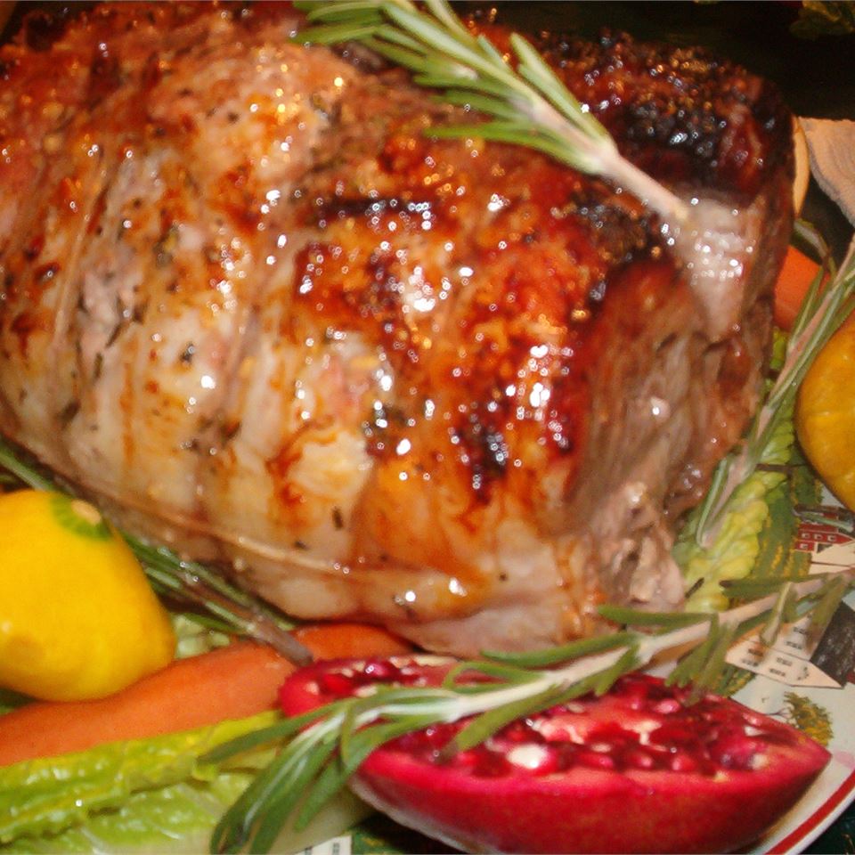 Rosemary-Scented Pork Loin Stuffed With Roasted Garlic, Dried Apricots and Cranberries and Port Wine Pan Sauce 