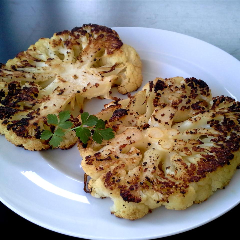 Simple cauliflower makes for a surprisingly elegant main dish when cut into hearty planks or "steaks." The key to getting uniform slices is to buy a large cauliflower.
                          