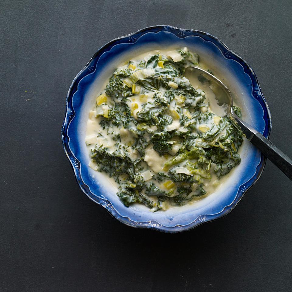 <p>Kale is simmered with leeks and garlic then "creamed" with flour and milk in this healthy take on creamed spinach. Serve alongside steak or roast chicken and a baked potato.</p>
                          