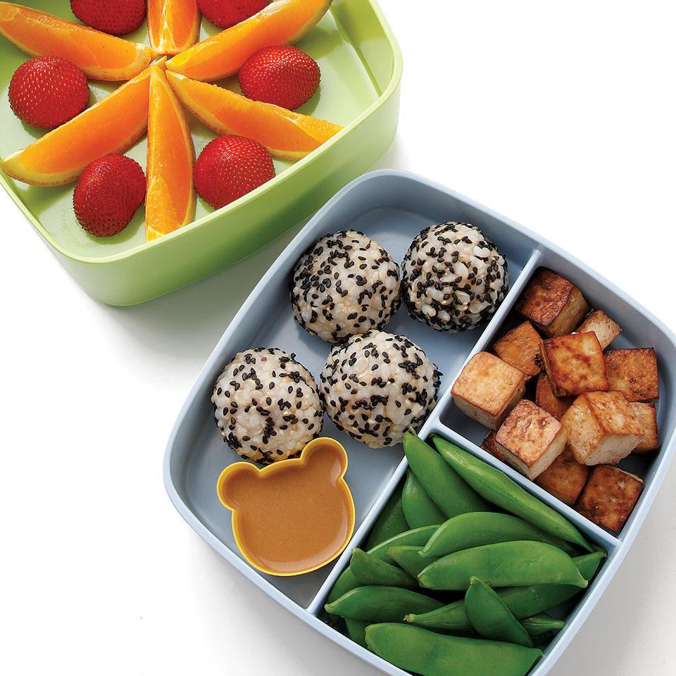 <p>Tofu, rice and vegetables are classic bento ingredients. Make extra rice for dinner and roll leftovers into balls for lunch. To keep green veggies vibrant and crisp, cook them briefly and immediately dunk them into a bowl of ice water. You can also use cubed store-bought baked tofu in place of the roasted tofu.</p>
                          