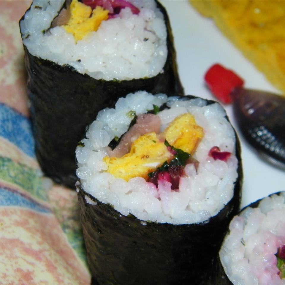 <p>Kimbap is frequently compared to Japanese sushi, but the only true similarities between these two dishes are their seaweed wrappers and their inclusion of rice. Unlike sushi, kimbap does not involve raw fish or other raw seafood. Instead, the filling consists of eggs, meat, and vegetables. Kimbap shops are popular destinations for Koreans in search of breakfast, and this recipe fully dives into an East-West hybrid model by adding ham and American cheese to the kimbap.</p>
                          