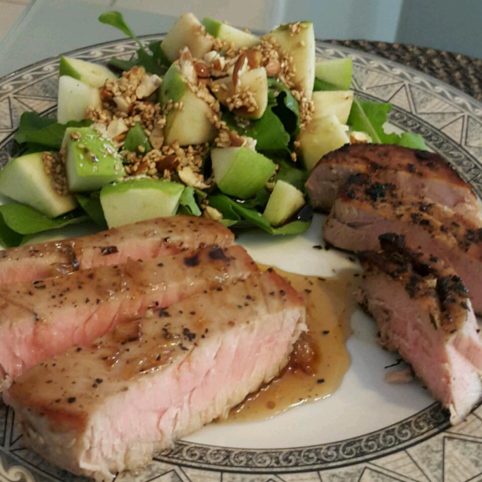 Seared tuna steaks are smothered in caramelized onions and a sweet and sour pan sauce. "Completely authentic recipe for Sicilian style tuna steak," says wisewoman. "My grandmother made it too!"
                          