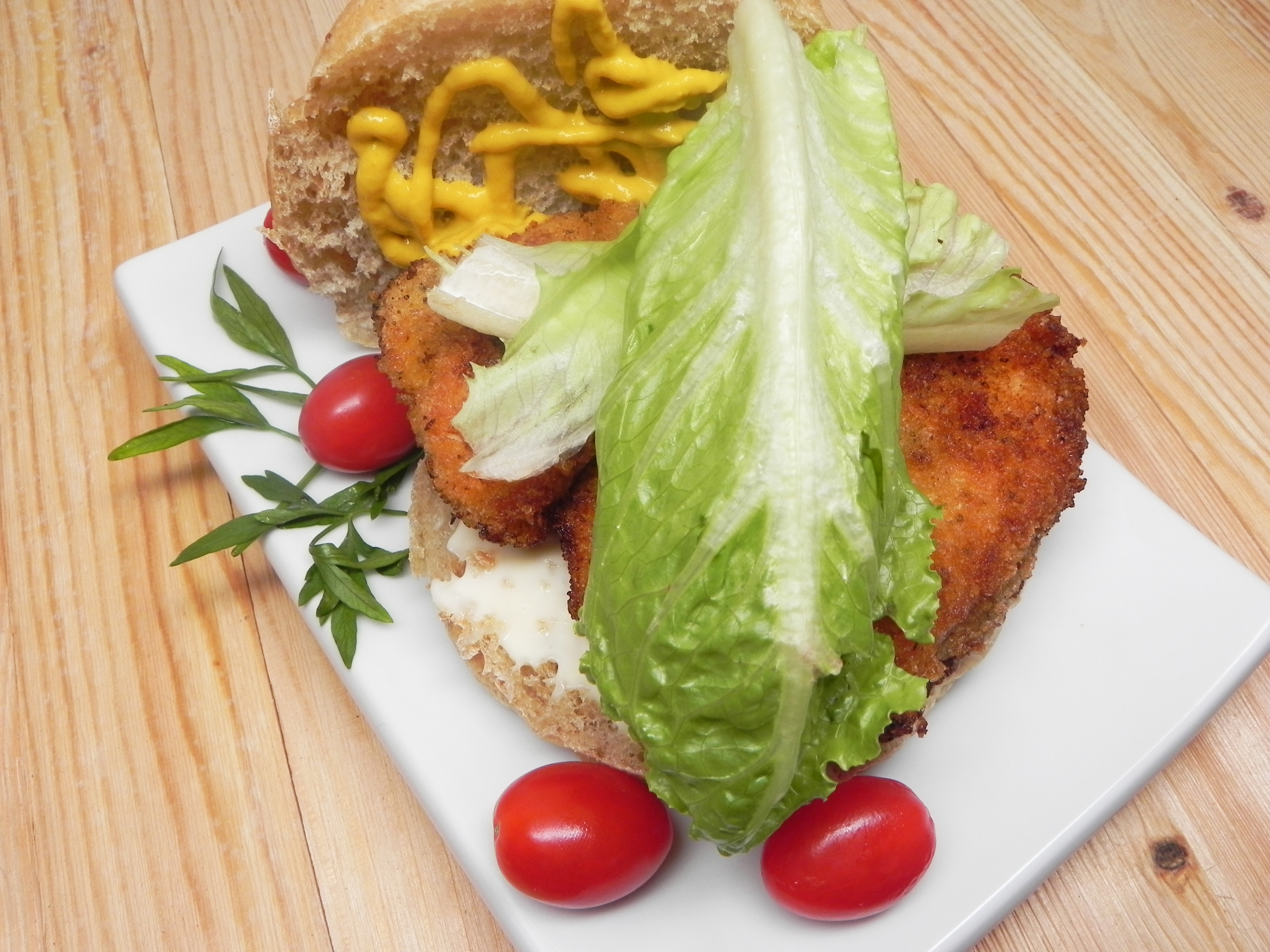 <p>A simple and delicious fried chicken schnitzel, served in a crusty sub roll with mayo, mustard, and hot sauce. Add as many salad vegetables as you like. Recipe creator daniellev14 says this fried chicken sandwich pairs perfectly with a cold beer and a handful of chips.</p>
                          