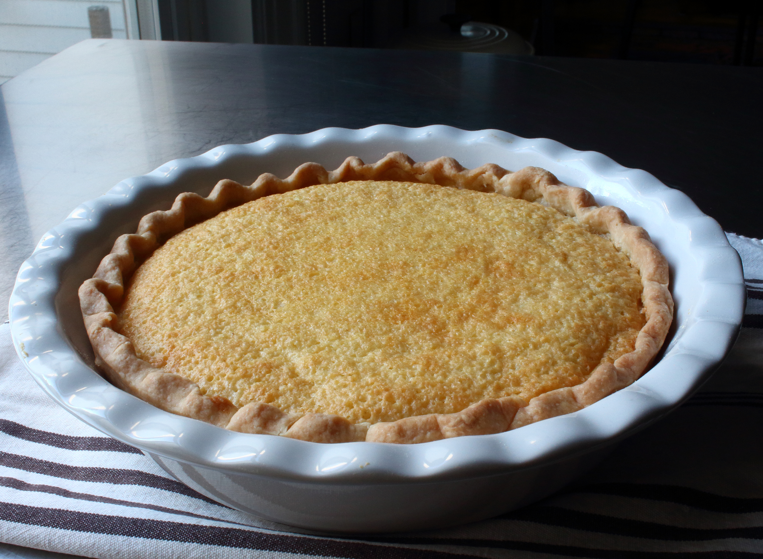 <p>Chef John's take on buttermilk pie deviates from the classic by taking on a tangier flavor that no other custard pie can touch. Think vanilla custard meets meringue and then meets light cheesecake, and amplify it. To amp up the fluffiness, separate the eggs and beat the whites with a hand mixer for a few minutes, then fold both the whites and yolks in as written. </p>
                          <p>Related: 30 Buttermilk Cakes to Use Up Your Carton</p>
                          