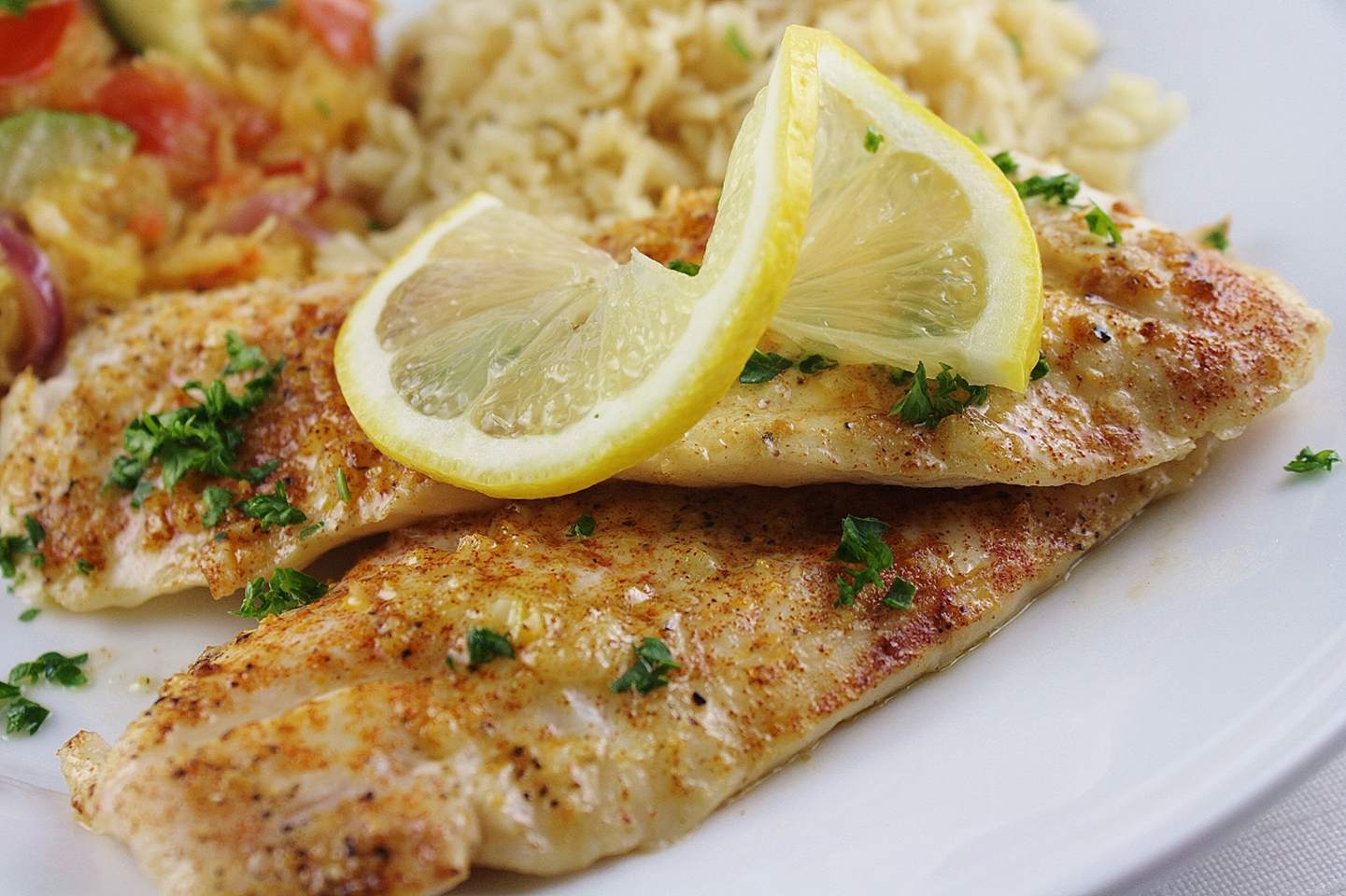 <p>Tilapia fillets are baked in a simple lemon juice and butter sauce. "My husband and I love shrimp scampi," says JasnsWif. "Since tilapia is usually cheaper than shrimp at the store, I concocted this easy recipe to enjoy the flavor of scampi at the price of tilapia!"</p>
                          