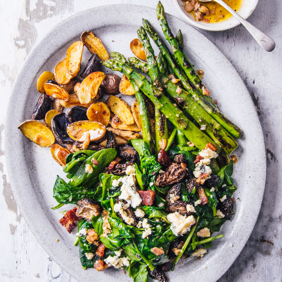 <p>In this hearty spinach salad recipe, asparagus and potatoes star next to bold morel mushrooms, bacon and blue cheese. Mature spinach works best here--it'll hold up better than baby spinach when tossed with warm vegetables and a sharp, mustardy vinaigrette.</p>
                          