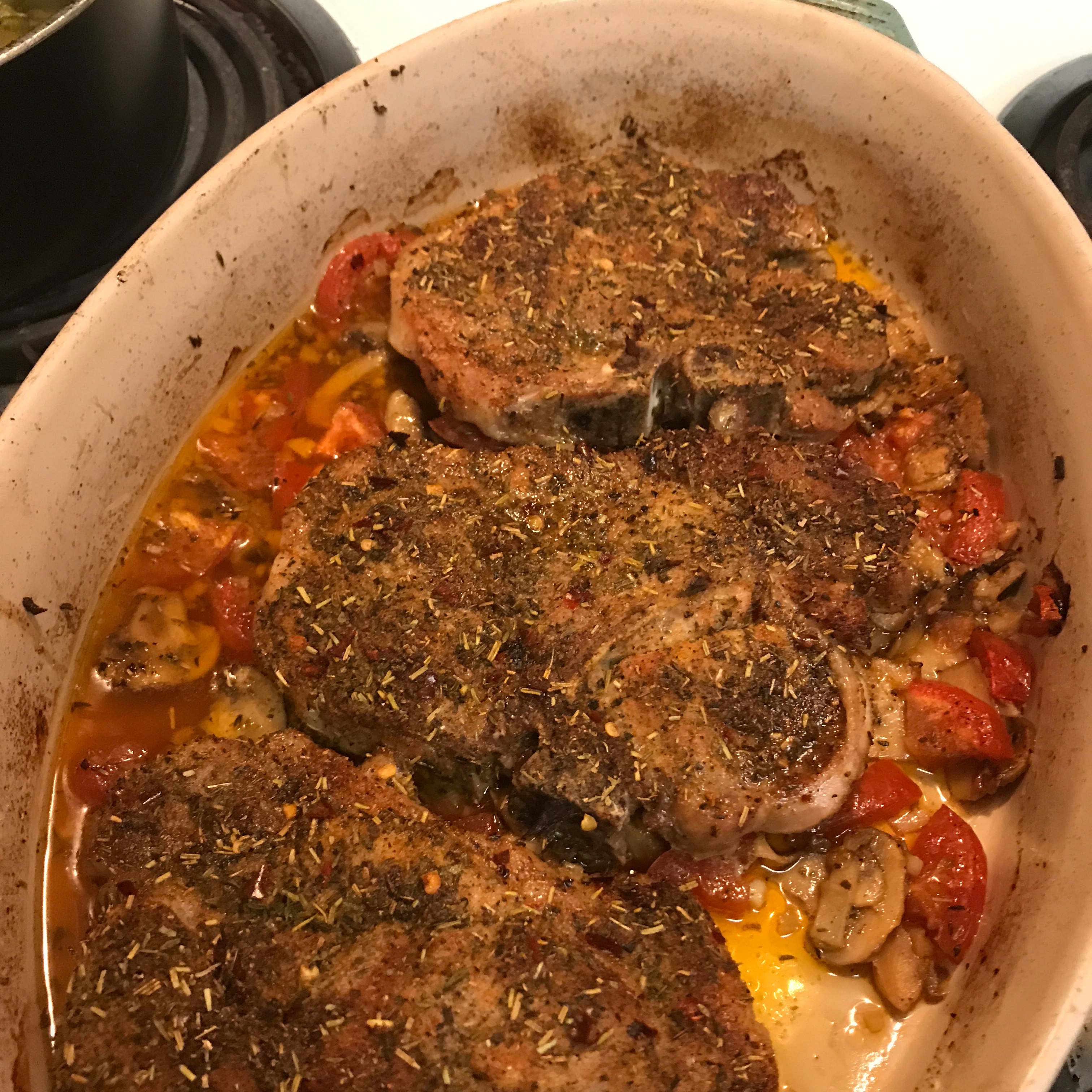 Roasted Pork Chops with Tomatoes, Mushrooms, and Garlic Sauce 