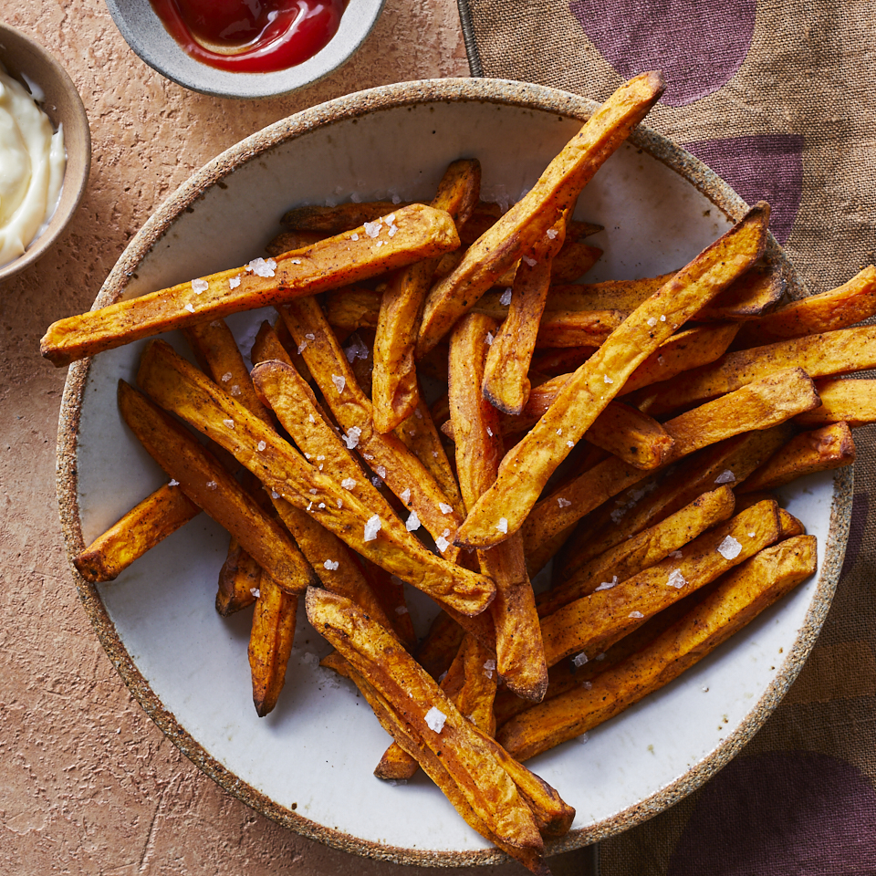 <p>Air-fried sweet potato fries are crispy, tender and delicately sweet. They're also made with less fat than traditional fries, so they're a healthier option when you're craving crunchy spuds. If the cinnamon-pepper spice is too intense, try thyme, oregano, paprika or garlic instead.</p>
                          