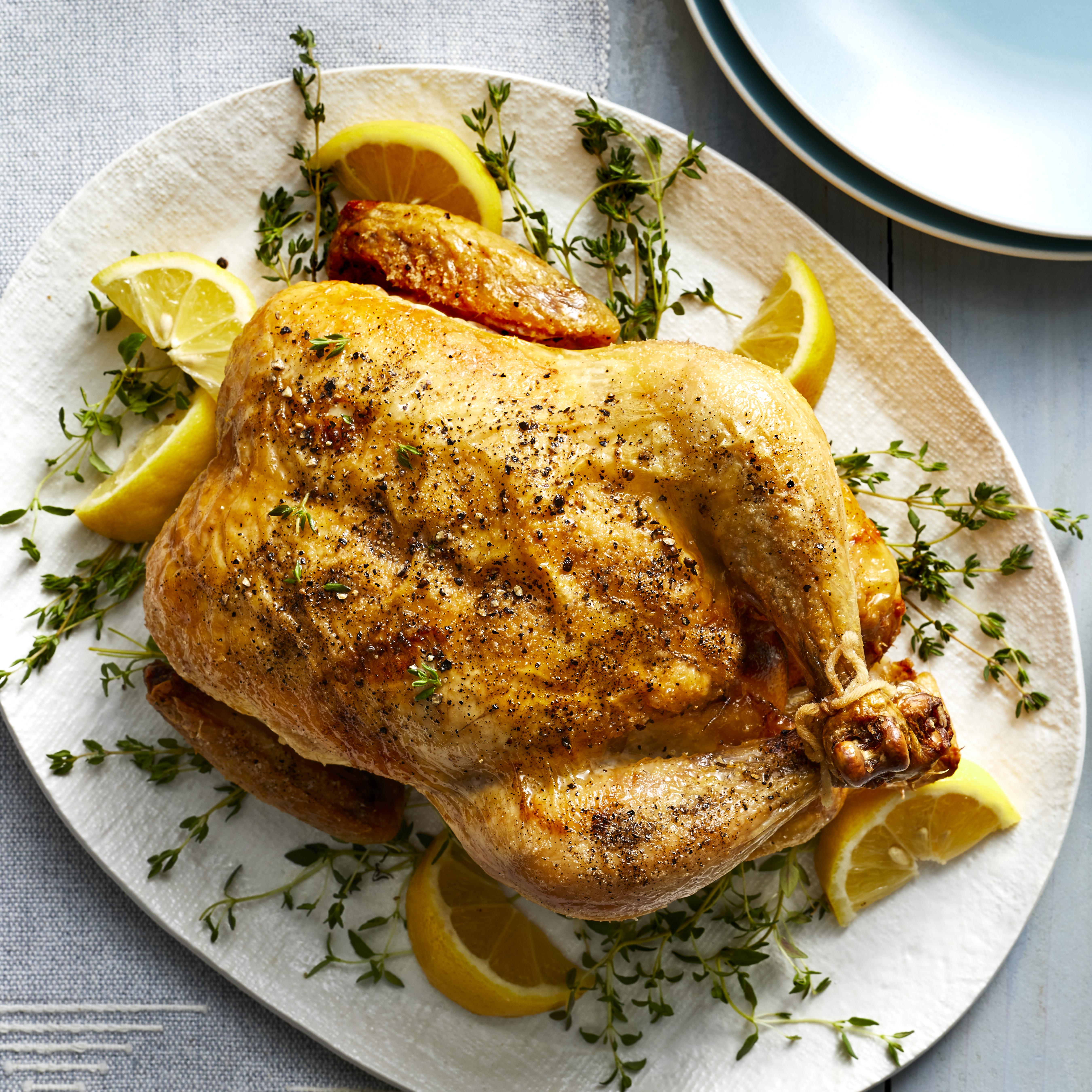 <p>Replicate the flavor, lovely burnished skin and moist texture of a classic rotisserie chicken with this easy recipe for cooking a whole chicken in your air fryer. With just a handful of ingredients and 10 minutes of active time, you get a roast chicken with lemon and herbs that's a remarkable doppelganger for a deli chicken right after it comes out of the rotisserie--before it gets shriveled and dried out from sitting in the deli's holding case for hours. Serve this chicken with your favorite veggie sides for a healthy weeknight dinner or weekend supper. And if you're hosting a dinner party, cooking your main course in the air fryer is also a great way free up oven space for casseroles, rolls and other dishes.</p>
                          