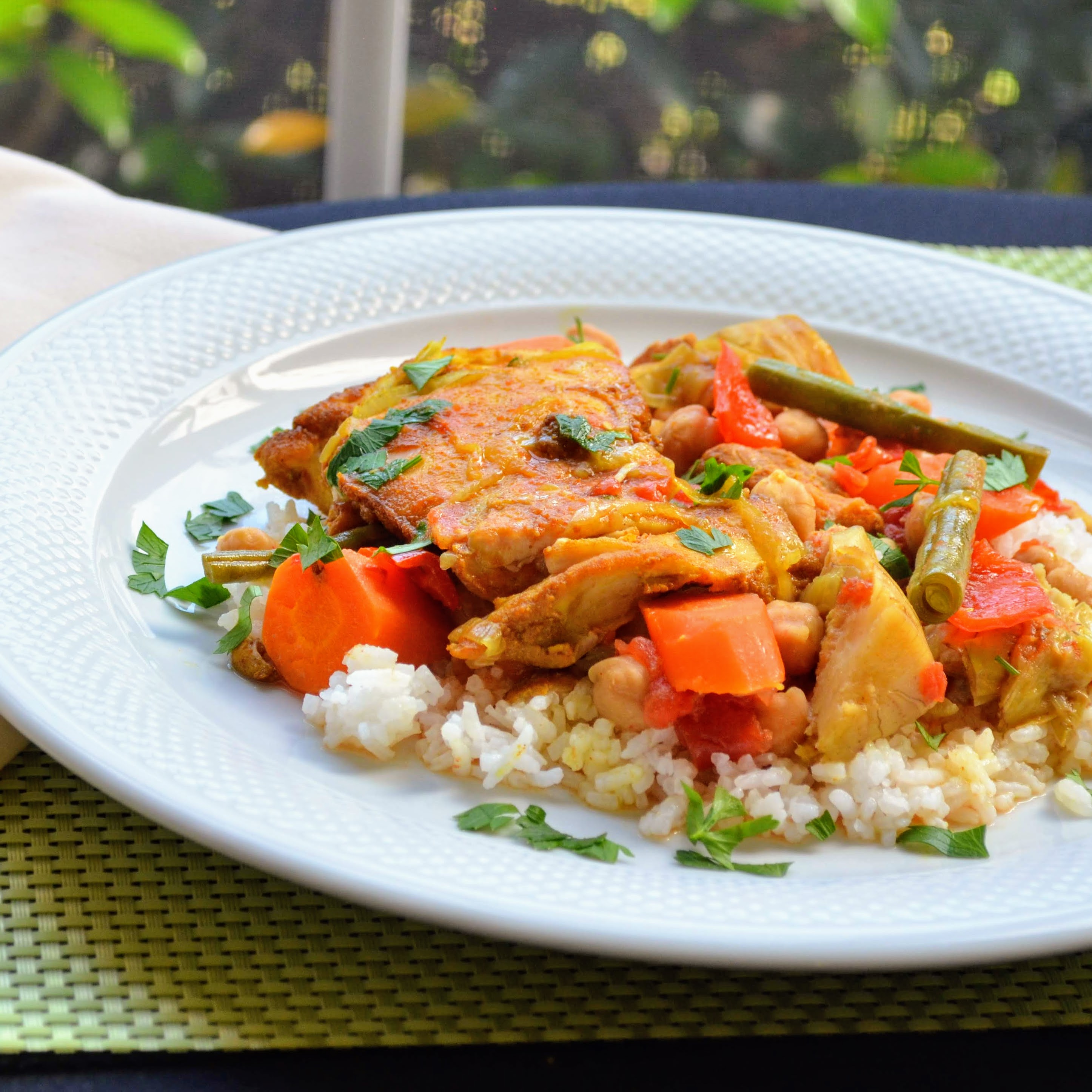 Here's a simple chicken and vegetable medley. Chicken thighs are seasoned with turmeric, ginger, coriander, cumin, and cayenne pepper and combined with chickpeas, diced tomatoes, artichoke hearts, carrots, onions, and garlic. Add green beans and bell peppers toward the end of cooking. "This delicious slow cooker meal of chicken and vegetables pairs up nicely with couscous and pita bread," says DebMCE4.
                          
