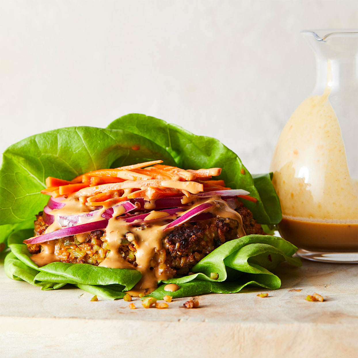 <p>Edamame make these homemade veggie burgers mean, green protein machines. Peanut sauce, curry paste and quick-pickled carrots give them Thai-inspired flair.</p>
                          