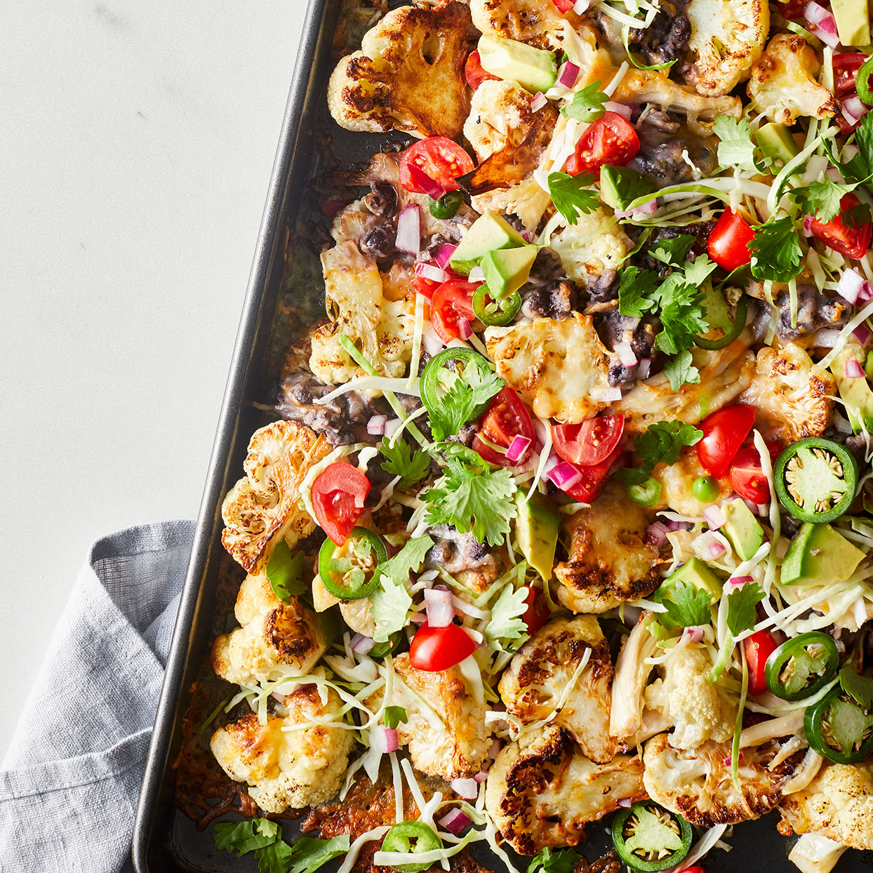 <p>Swapping in tender-crisp cauliflower slices for chips in these cauliflower nachos ups your veggie servings for the day.</p>
                          
