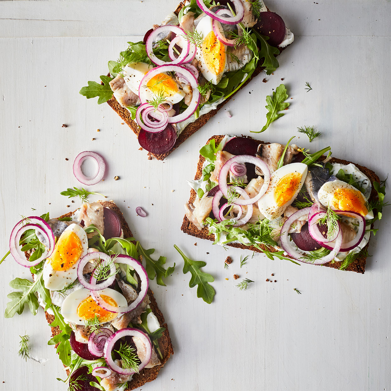 <p>Smoked salmon isn't the only flaky fish made for breakfast breads. This pickled herring arrangement makes a delicious sm&oslash;rrebr&oslash;d with all the fixings. Or lay the ingredients out on a board and let everyone top their own!</p>
                          <p> </p>
                          