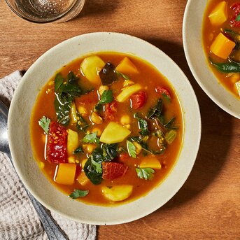 This vegan soup recipe is chock-full of colorful vegetables. All those veggies give this soup plenty of fiber, upping the satisfaction factor while keeping calories low, which can aid in weight loss and lead to--yes--a flatter belly. Vibrant turmeric adds a golden color to the flavorful broth, while cumin and ginger give it a bright, fresh finish. And the best part? This healthy soup recipe takes only 20 minutes, start to finish! Source: EatingWell.com, January 2020  